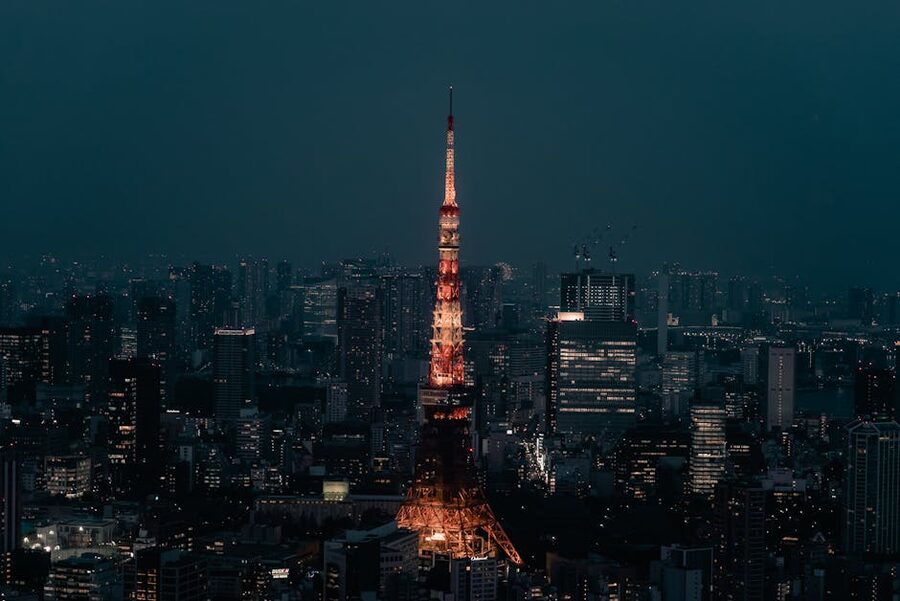 Tokyo Tower lit up at night in Minato City