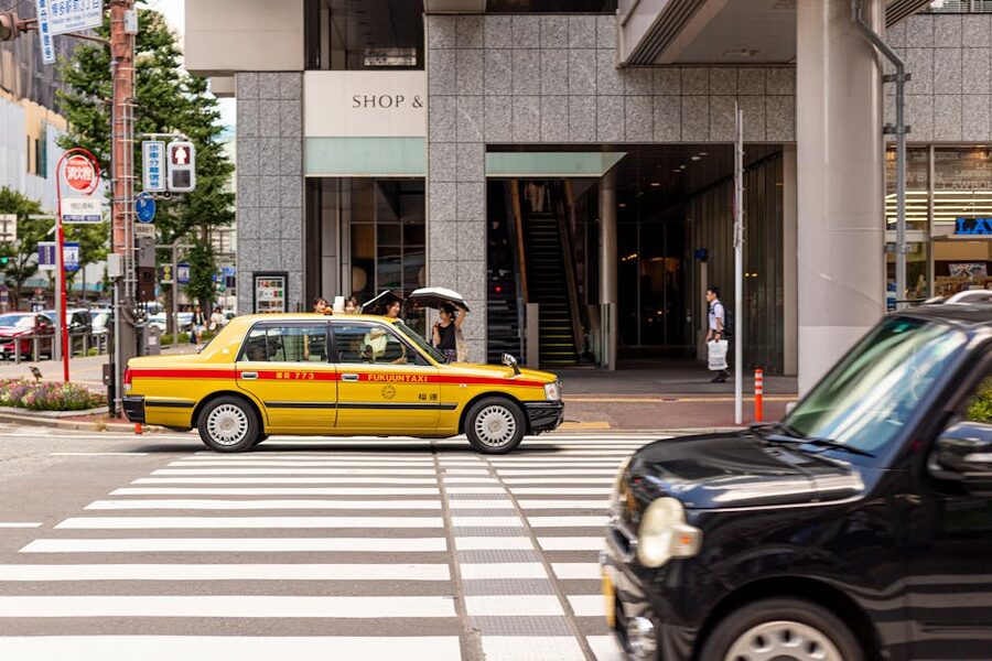 Yellow taxi on a Tokyo crosswalk
