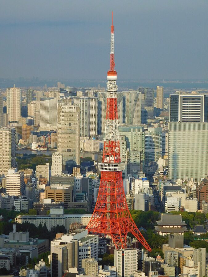 Close-up view of Tokyo Tower red steel lattice structure against sky