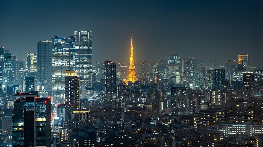 Wide panoramic view of Tokyo Tower across Minato City rooftops