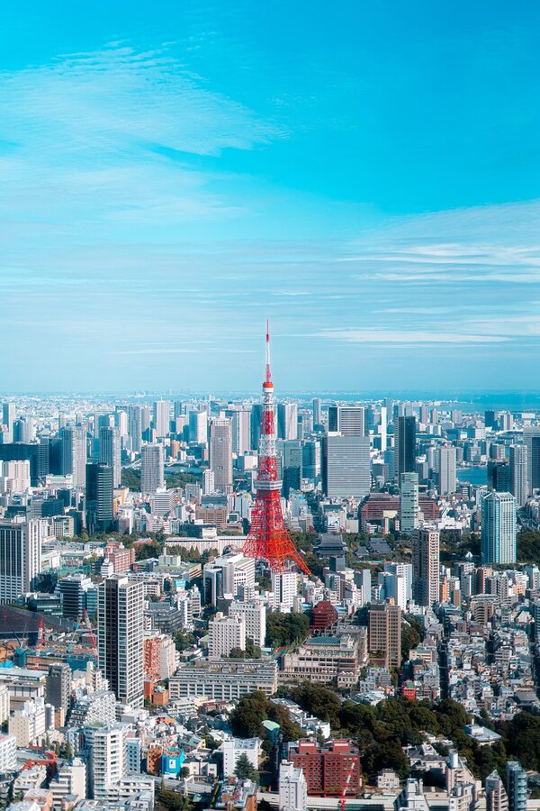 Tokyo Tower standing tall among Tokyo city buildings