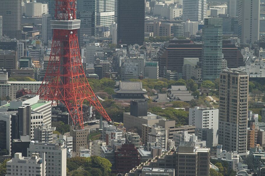 Classic view of Tokyo Tower rising behind Zojoji Temple grounds