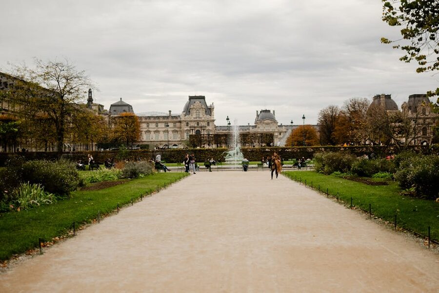Tuileries Garden in autumn with Louvre view Paris