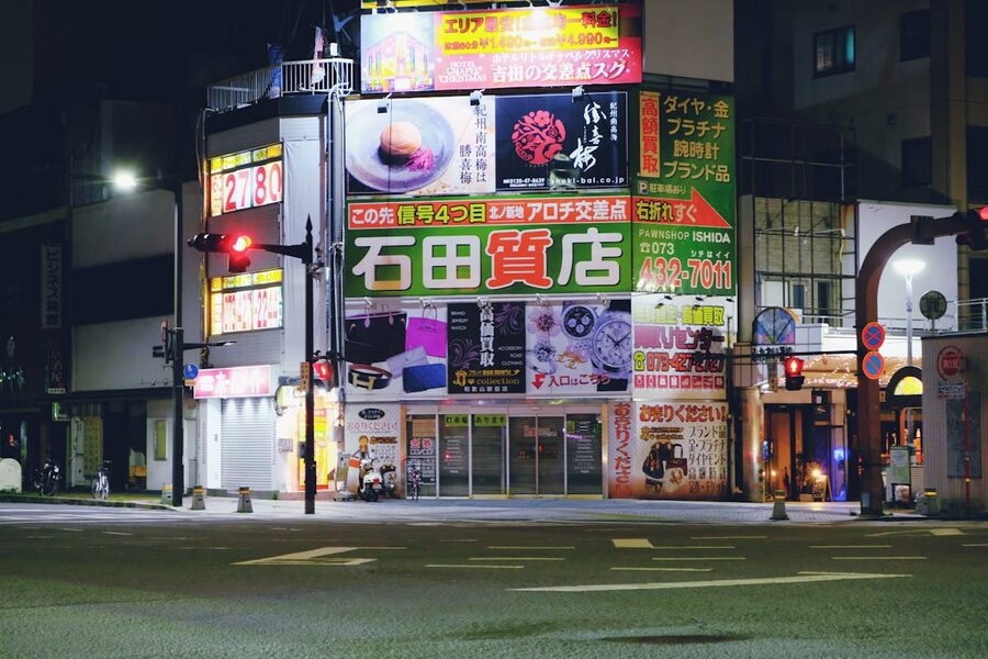 Advertisements on buildings at night in Osaka