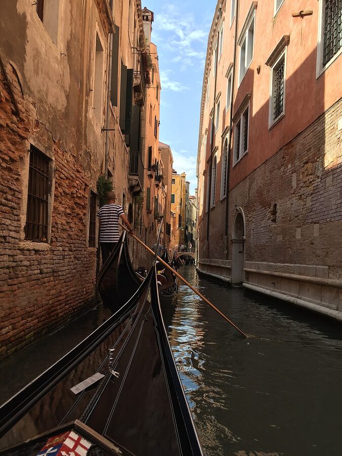 Gondola in a narrow Venice canal
