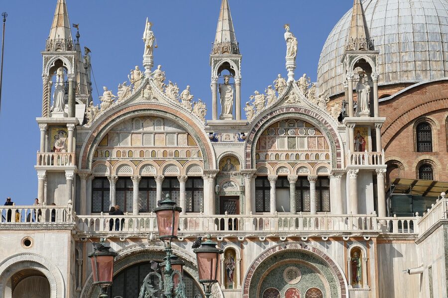 St Mark's Basilica facade with cathedral entrance arches and mosaics in daylight
