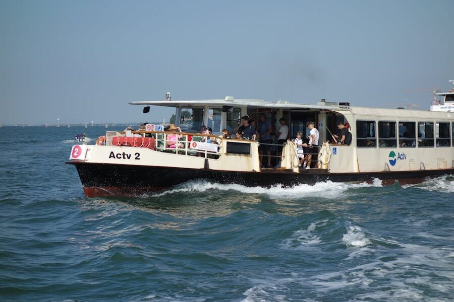 Vaporetto ferry on the Venetian lagoon with passengers heading to the islands