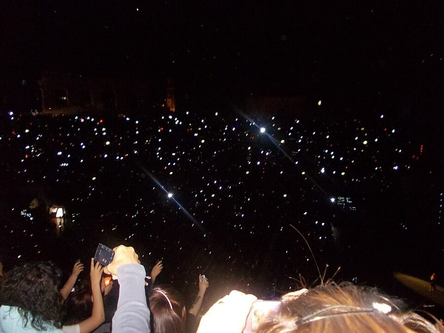 Verona Arena lit by audience phone lights at a concert