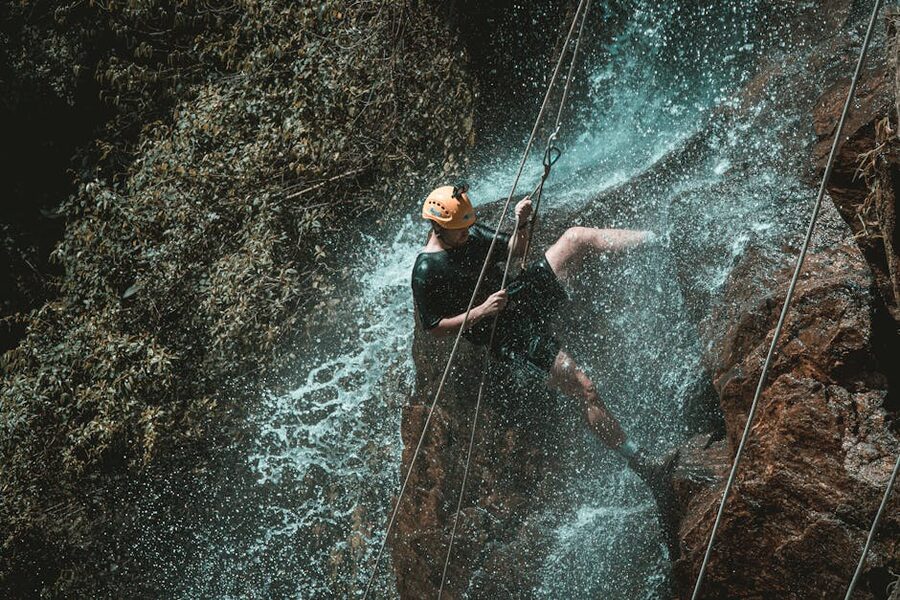 Vietnam waterfall plunging into a deep rock pool