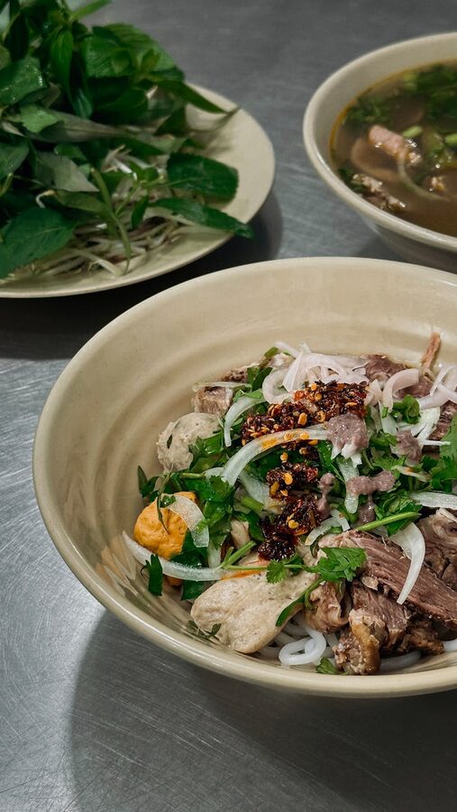 Vietnamese pho with fresh herbs and spices