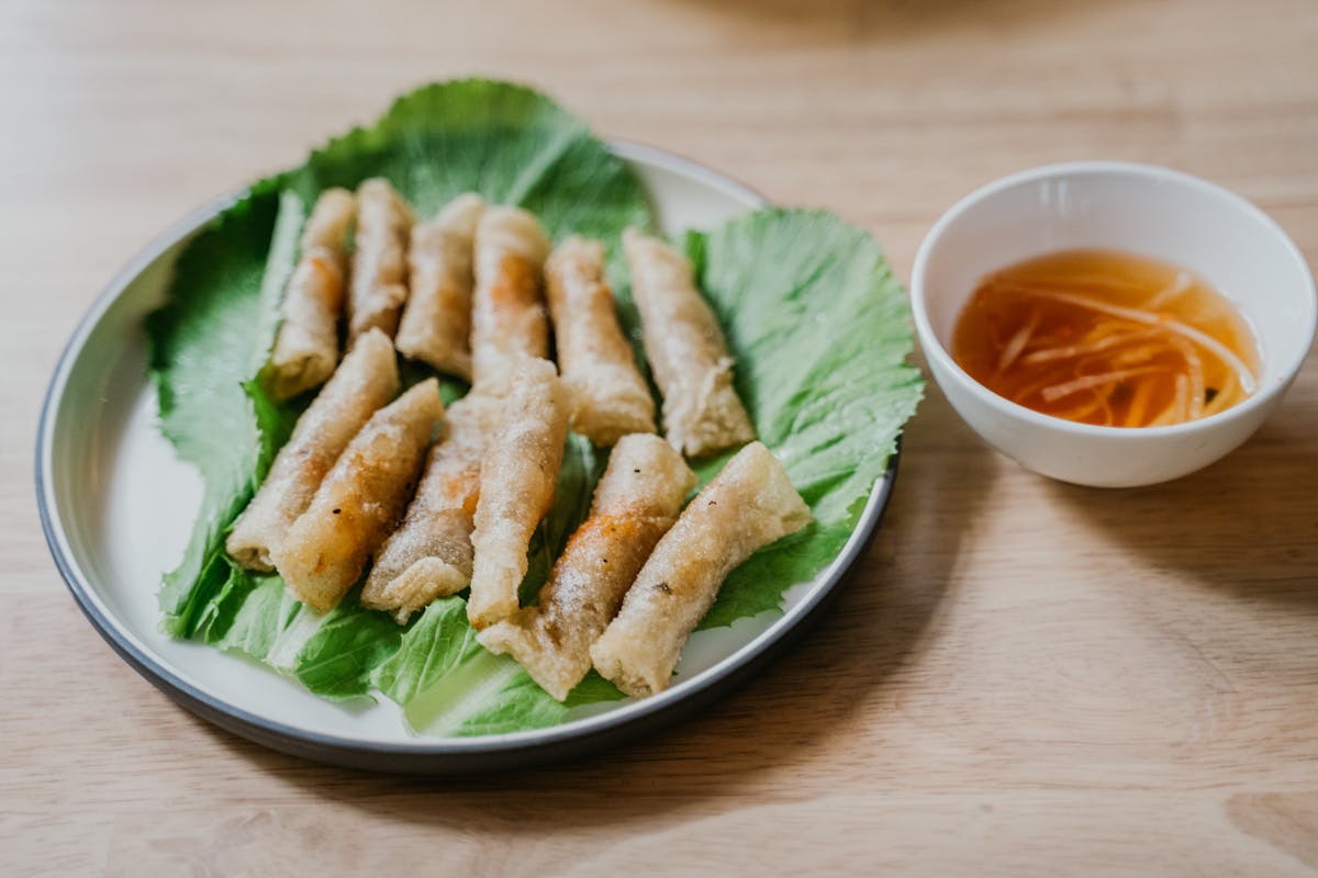 Vietnamese fresh spring rolls with dipping sauce on a plate