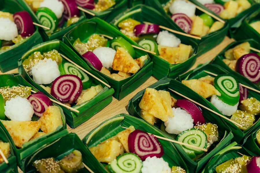 Vietnamese sweets and coconut candy in banana leaf trays