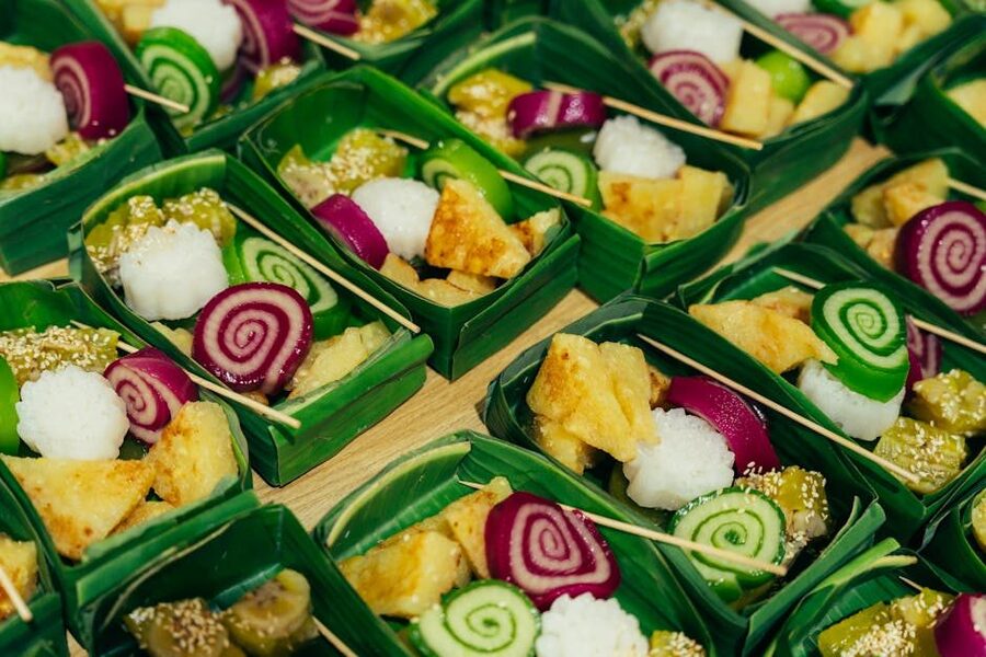 Colorful Vietnamese sweets presented in banana leaf trays