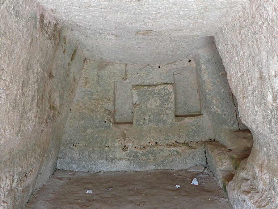 Interior of a rupestrian rock church in Matera with surviving frescoes