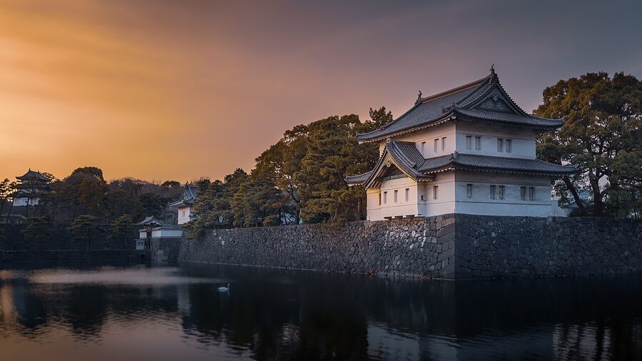 The Tatsumi Yagura corner watchtower of the Tokyo Imperial Palace reflected in the moat water