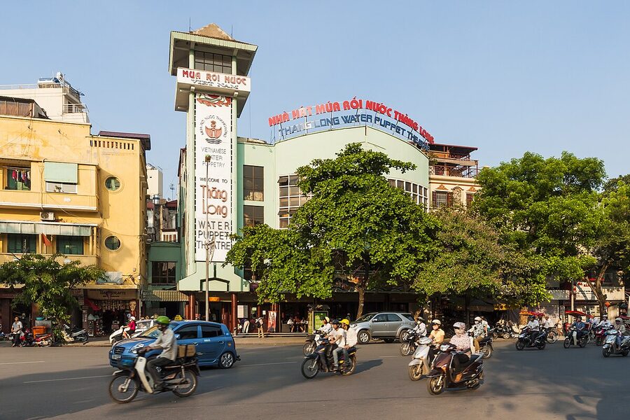 The Thang Long Water Puppet Theatre building in Hanoi at night with its illuminated facade