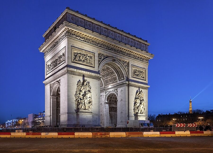The Arc de Triomphe illuminated at night