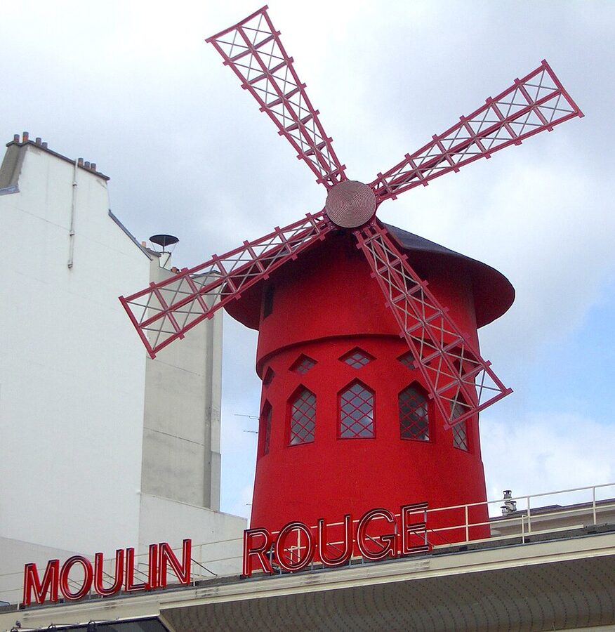 Moulin Rouge facade with red windmill Paris
