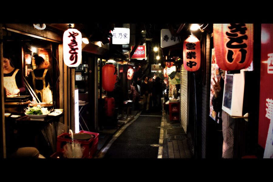 Yakitori shop lanterns strung across Omoide Yokocho with hand-painted menus