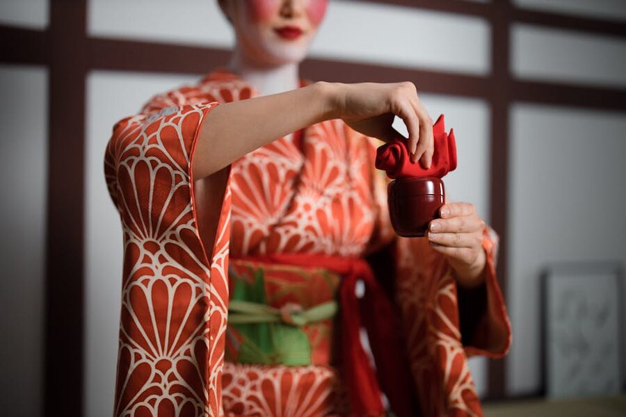 Woman in kimono performing tea ceremony
