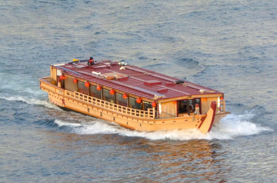 Traditional yakatabune boats cruising near Odaiba on Tokyo Bay