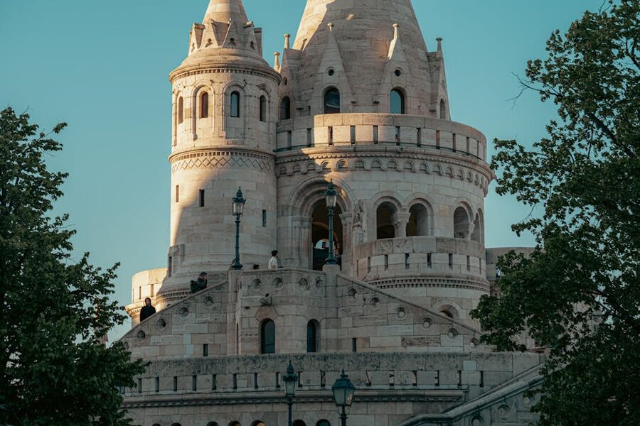 Fishermans Bastion in Budapest at sunset with warm light on the white turrets