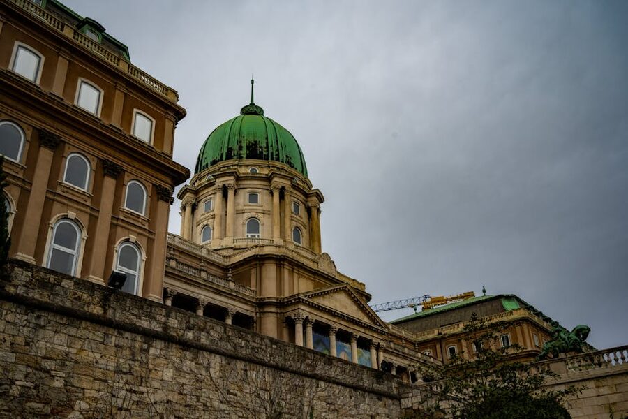 Buda Castle with green dome on a cloudy day