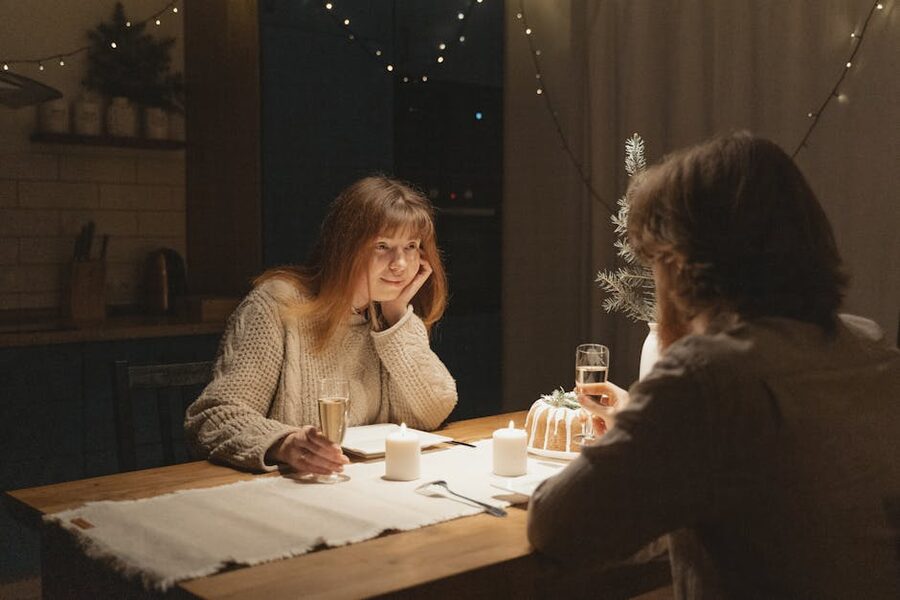 Couple at a candlelit dinner with champagne