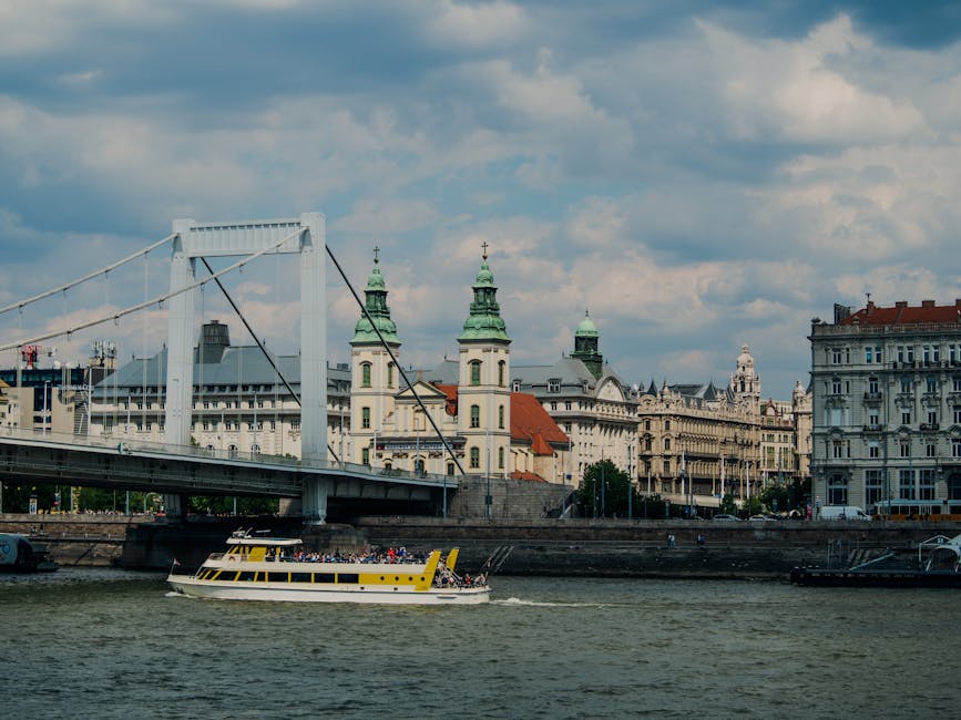Riverboat cruise passing under Elizabeth Bridge in Budapest