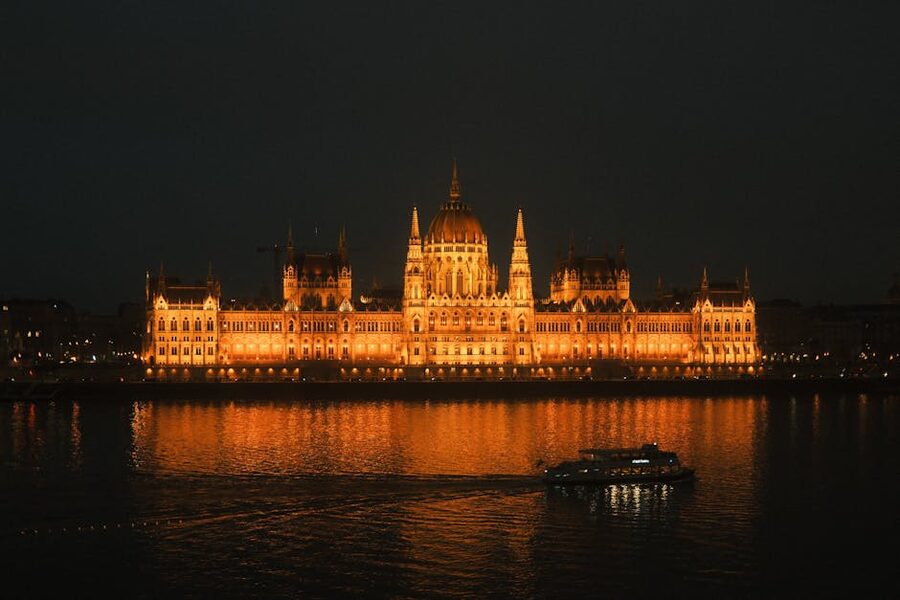 Hungarian Parliament reflected on the Danube River at night