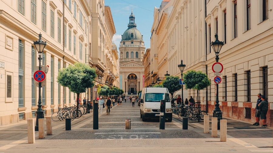 Square outside St Stephens Basilica with morning visitors, Budapest