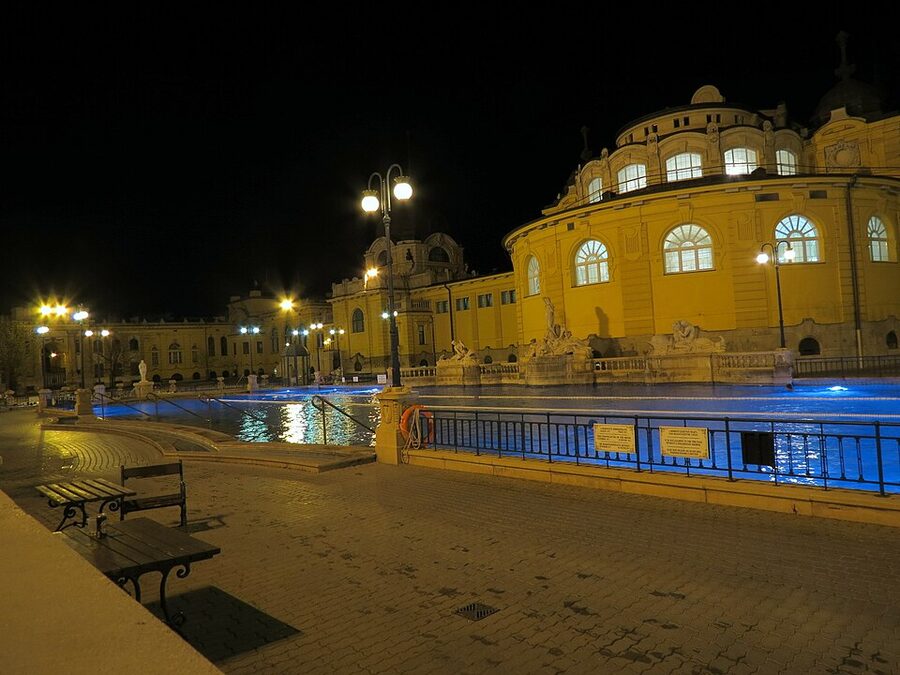 Szechenyi at night with lit pools and steam