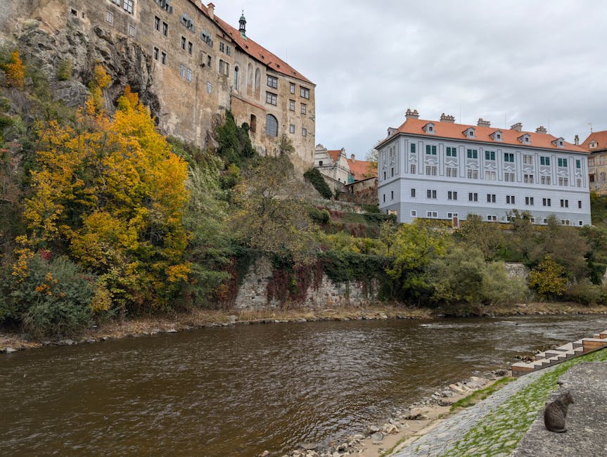 Cesky Krumlov castle in autumn with red and orange foliage
