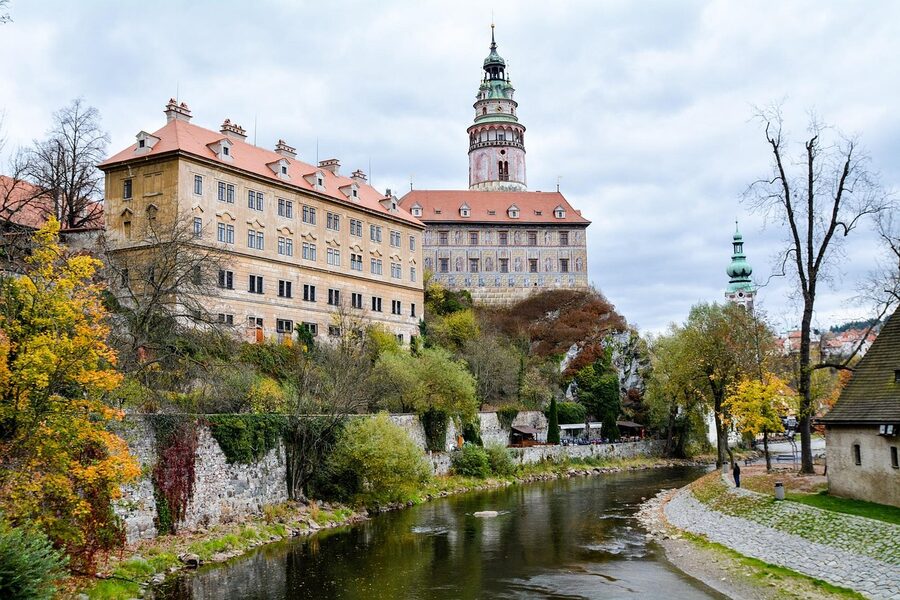 Cesky Krumlov old town roofs above the Vltava with green spaces