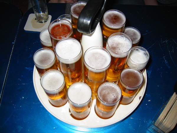 A Kranz wooden tray loaded with Stange glasses of Koelsch