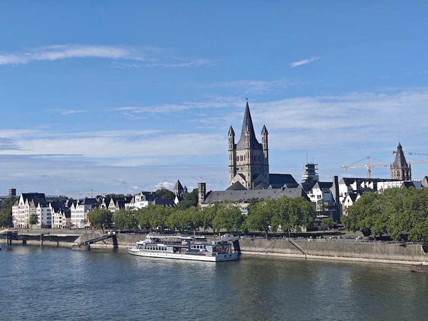 Cologne riverside with Great St Martin Church and Rhine boats