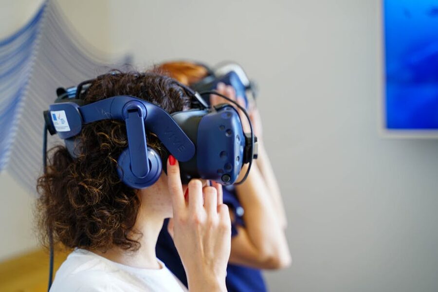 Visitors using VR headsets inside an indoor experience
