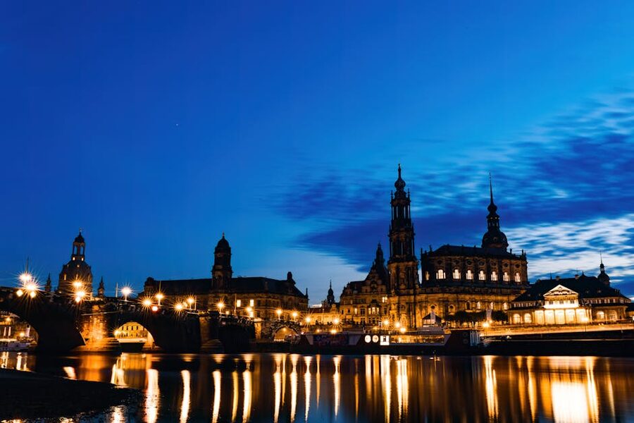 Dresden Hofkirche cathedral reflected in water in the evening