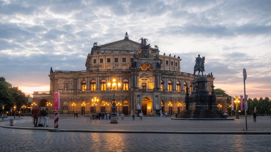 Semperoper Dresden at twilight with King Johann statue