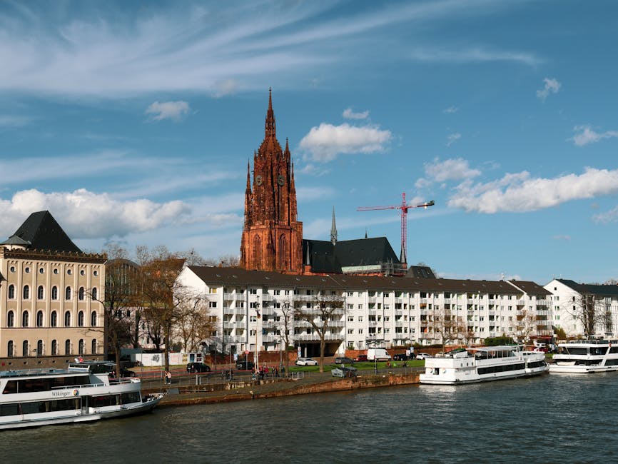 Frankfurt Cathedral and tour boats moored at the Mainkai waterfront
