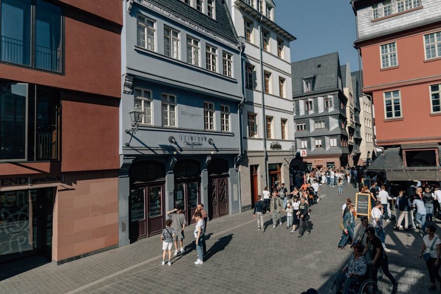 People walking in Frankfurts old town on a sunny day