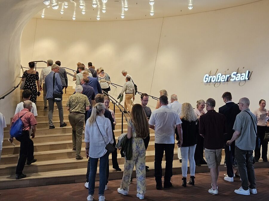 Inside the Elbphilharmonie showing the wave-form ceiling and white walls