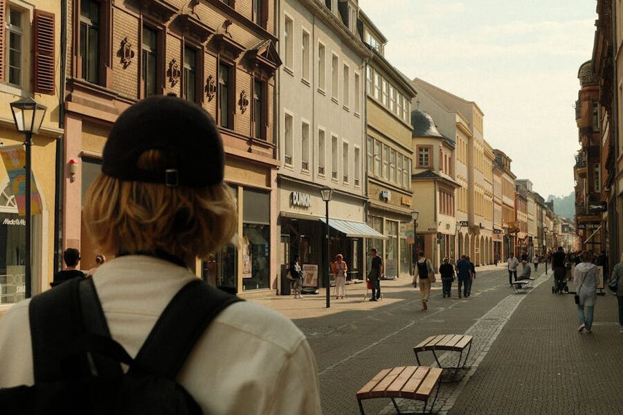 People walking along Heidelberg Hauptstrasse shopping street
