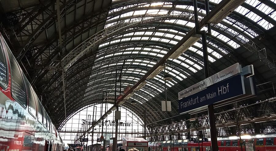 The arched canopy roof of Frankfurt Hauptbahnhof at platform level