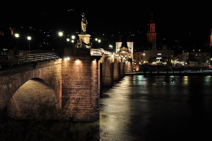 Heidelberg Alte Bruecke and castle illuminated at night