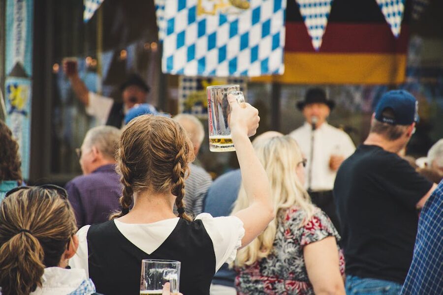 Oktoberfest crowd raising beer steins Munich