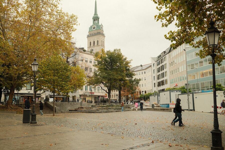 Autumn street scene in central Munich Old Town with pedestrians