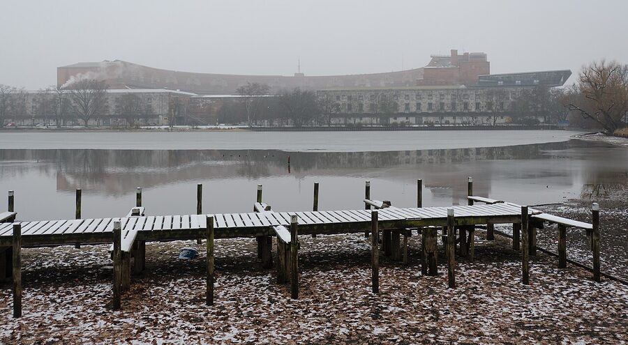 The Congress Hall reflected in the Dutzendteich lake in winter