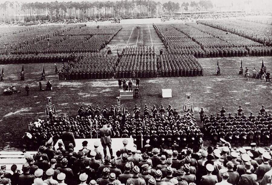 Historical photograph of the 1934 Nuremberg rally with crowds at the Zeppelinfeld