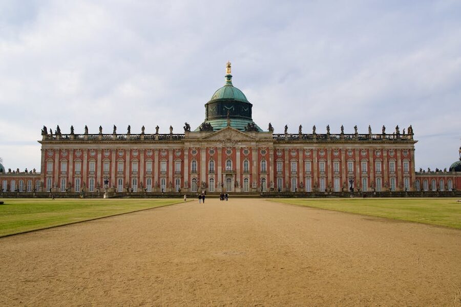 New Palace at Sanssouci Park baroque architecture under clouds